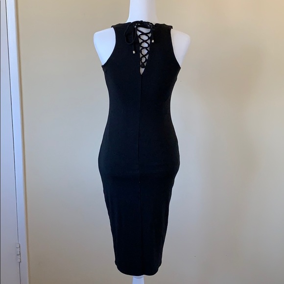 White House Black Market Dresses & Skirts - Pretty little black dress w/ tie up detail